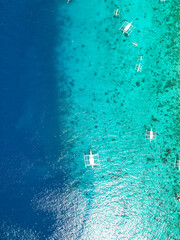 Beautiful beaches and hopping boats on Balikasak Island, Bohol, Philippines, a sacred place for scuba diving (traditional Philippine boats, banca)