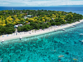 Beautiful beaches and hopping boats on Balikasak Island, Bohol, Philippines, a sacred place for scuba diving (traditional Philippine boats, banca)