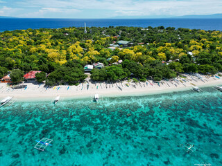 Beautiful beaches and hopping boats on Balikasak Island, Bohol, Philippines, a sacred place for scuba diving (traditional Philippine boats, banca)