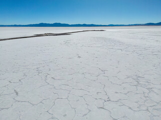 Aerial view of the huge salt flats Salinas Grandes de Jujuy in northern Argentina while traveling...
