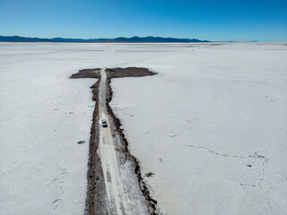 Aerial view of the huge salt flats Salinas Grandes de Jujuy in northern Argentina while traveling...