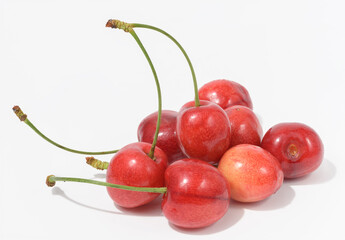 Ripe red cherry on a white background