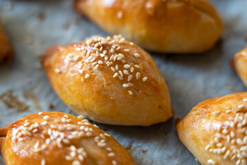 Turkish pastry pogaca with cheese filling on oven tray