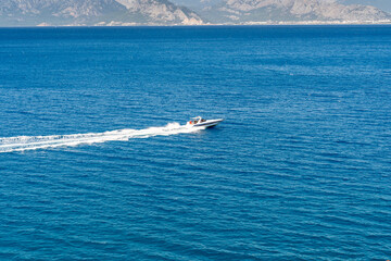 Tourism center Antalya province, Mediterranean gulf, cliffs, konyaaltı beach. Taurus mountains in the background