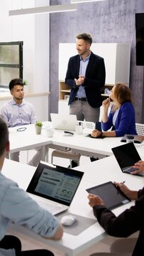 Company Inside Meeting In Office Boardroom