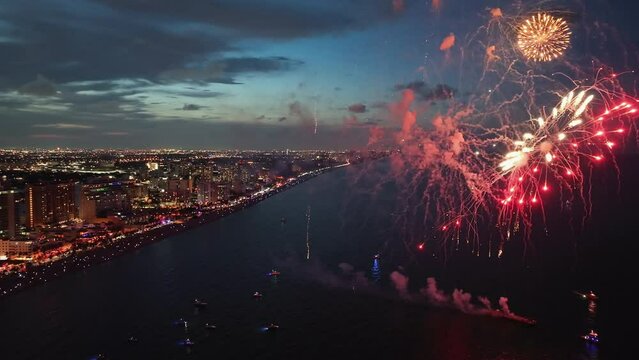 Fireworks display above the ocean along Fort Lauderdale coastline at sunset