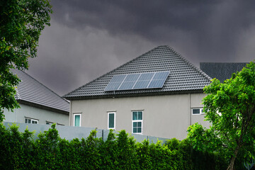 Solar panels on the roof of a modern housing estate Solar panels appears on the roof of a suburban...