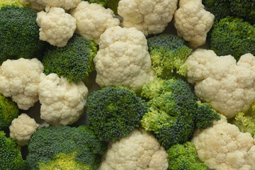 Photo of broccoli and cauliflower taking up all the space of the picture for the background,...