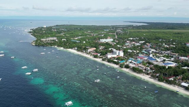 Alona Beach on the island of Vauxhall Pangrao, Philippines, with beautiful beaches and hopping boats (traditional Philippine boats, banca)