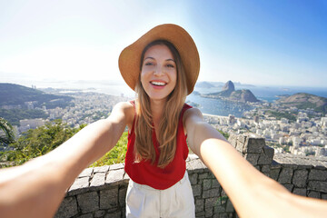 Self portrait of traveler girl with famous Guanabara Bay with Sugarloaf Mountain in Rio de Janeiro,...