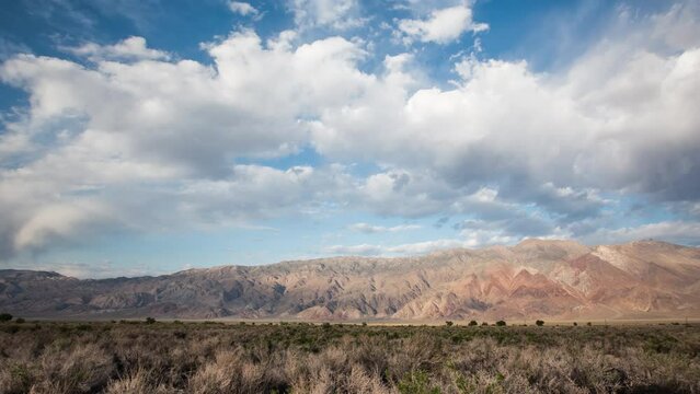 Time-Lapse of clouds over a desert mountain range in California