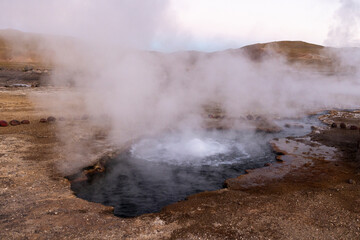 Exploring the fascinating geothermic fields of El Tatio with its steaming geysers and hot pools high up in the Atacama desert in Chile, South America
