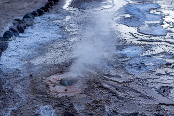 Exploring the fascinating geothermic fields of El Tatio with its steaming geysers and hot pools high up in the Atacama desert in Chile, South America
