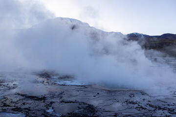 Fototapeta na wymiar Exploring the fascinating geothermic fields of El Tatio with its steaming geysers and hot pools high up in the Atacama desert in Chile, South America