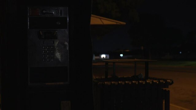 Vintage Pay Phone at Night 