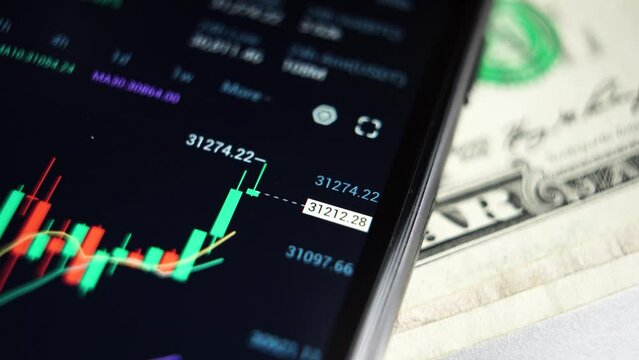 Real-time analysis of the cryptocurrency market in a smartphone. close-up