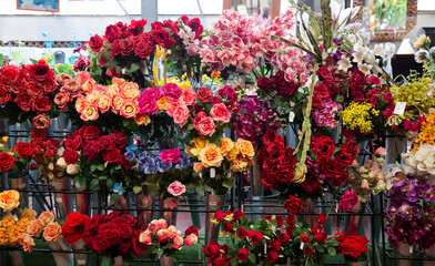 Fototapeta na wymiar artificial flowers prepared for sale on display in shop