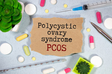 PCOS Polycystic ovary syndrome written in spiral notebook on doctor desk