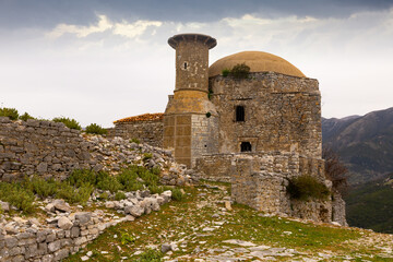 External view of Hajji Bendo Mosque in Borsh (Sopot) Castle in Albania. - obrazy, fototapety, plakaty