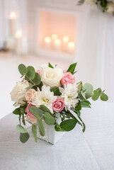 romantic bouquet of flowers near the fireplace in pastel colors delicate colors of roses date decor