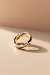 Gold wedding rings on pastel background