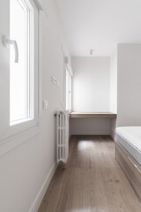 Bedroom of a house with a wooden sofa