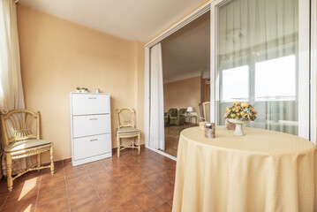 small screened-in terrace off a sitting area separated