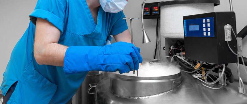 Embryologists a Liquid Nitrogen Bank Containing Sperm and Eggs Samples. ivf  in vitro fertilization, egg freezing. Sperm cryopreservation. Sperm freezing.