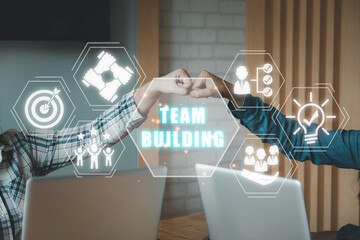 Team building concept, Young business people pump hands with team building icon on virtual screen, Stack of hands, Unity and teamwork concept.