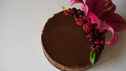 chocolate cake with a big flower on a white background