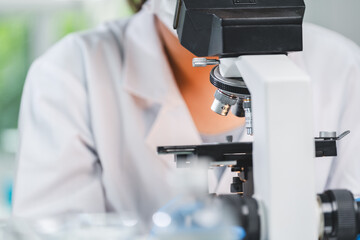 microscope tool technology using in laboratory, scientific equipment for microbiology science research, medicals scientist analysing experiment in term of biology or biotechnology for medicine test