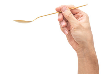 isolated of a man's hand holding a golden steel spoon.