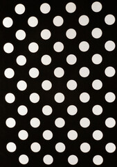 white polka dot pattern on a black background - obrazy, fototapety, plakaty
