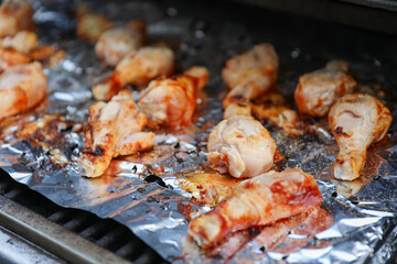 Sizzling skewers of beef, pork, chicken, and shrimp grilling over an open flame, representing indulgence, gathering, and culinary delights hot dogs and hamburgers too 
