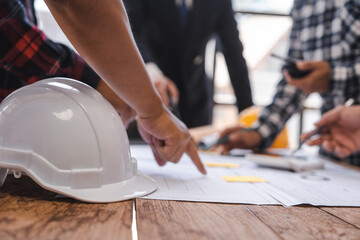 Factory Meeting Room of architect engineer meeting at working desk of blueprints construction concept. Engineer people concept