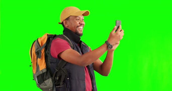 Green screen, selfie and black man with phone on a hike, adventure or journey and happy memory of travel with backpack. Smartphone, taking portrait and excited tourist trekking on tour or hiking