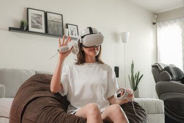 A woman is talking to someone in cyberspace by wearing VR headset or augmented reality. Future communication to connect people.