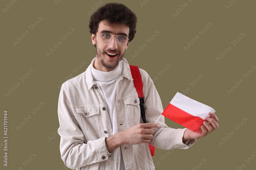 Canvas Prints Male student with flag of Poland on green background