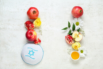 Composition with kippah, ripe fruits, honey and flowers on light background. Rosh hashanah (Jewish New Year) celebration