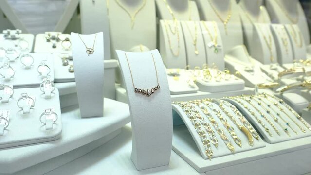 gold jewelery on jewelery rack