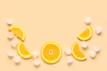 Frame made of orange slices and ice cubes on color background