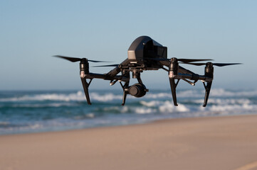 Medium shot of drone flying above beach, Great Barrier Reef.