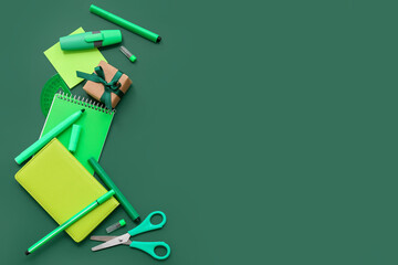 Gift box with different stationery on green chalkboard
