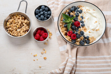 Healthy breakfast, cereal with berries and yogurt.