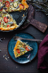Delicious vegetarian summer quiche with zucchini, tomato, mushrooms, sage and lavender with phyllo pastry
