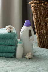 White plastic packaging with laundry detergent, liquid washing powder, conditioner, bleach, stain...