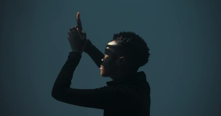 Musician: The woman uses hand and arm movements to create rhythmic patterns and conduct music, showcasing her skills as a percussionist or conductor.