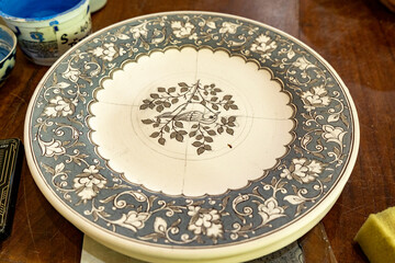a bird art in a plate