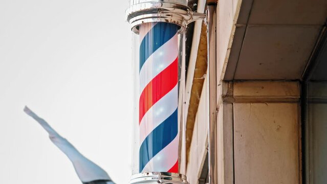 Barbershop Sign with Rotating Clored Stripes Helix Pole
