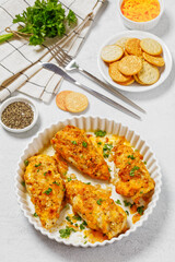 baked chicken breasts under cracker cheese crust